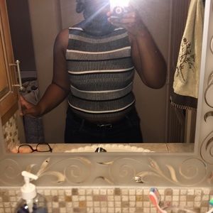 Black and white sleeveless turtleneck